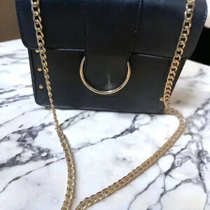 BLACK STUDDED LEATHER CROSSBODY WITH GOLD CHAIN STRAP AND GOLD BUCKLE CLOSURE